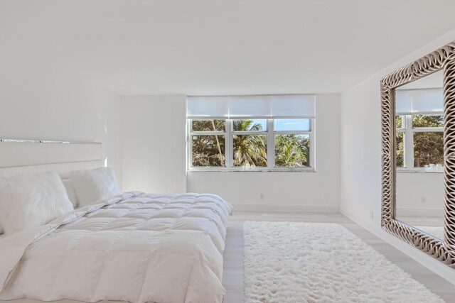 bedroom with light hardwood / wood-style flooring