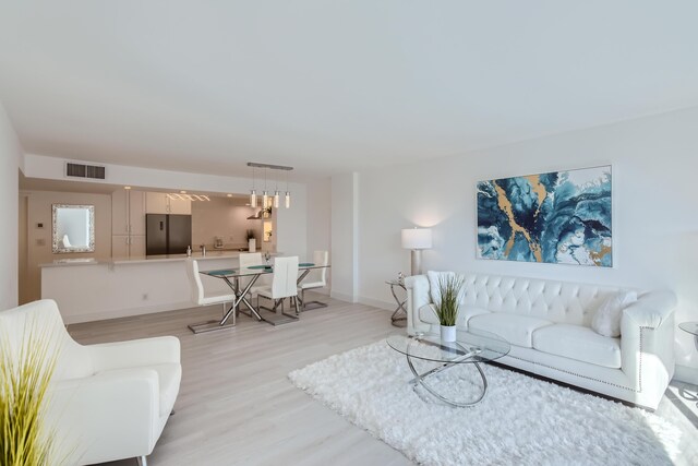 living room featuring hardwood / wood-style floors and expansive windows