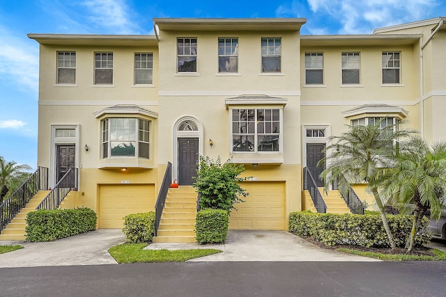 multi unit property featuring a garage