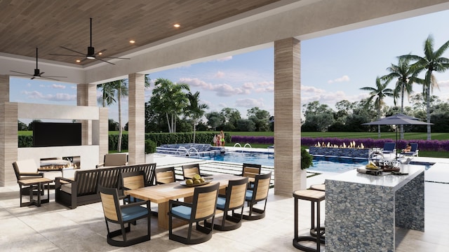 view of patio / terrace with ceiling fan and pool water feature