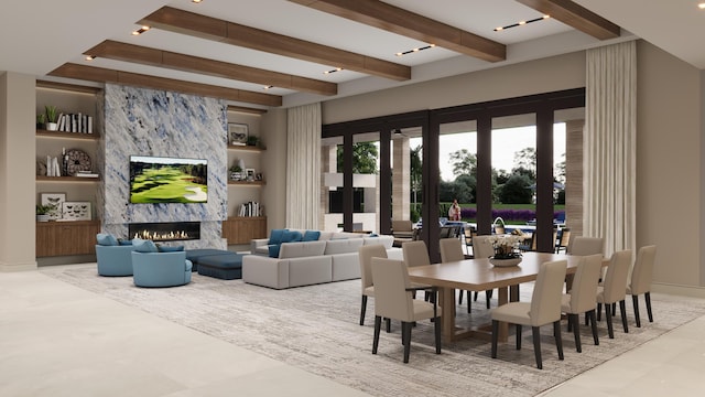 dining space featuring built in features, a high end fireplace, and beamed ceiling