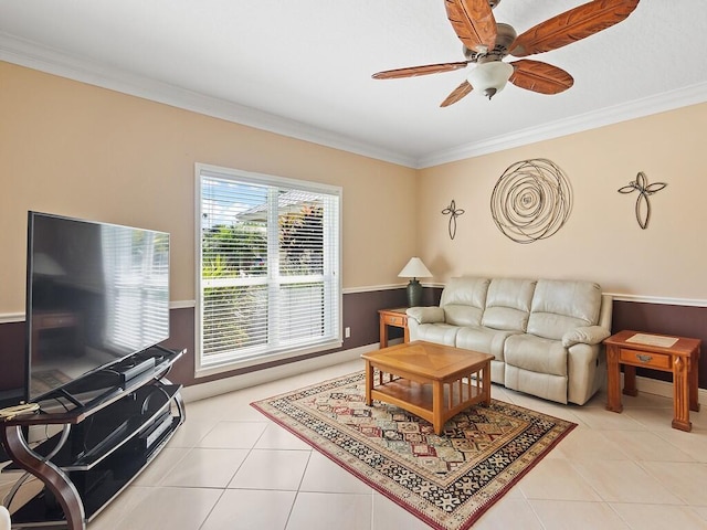 tiled living room with ornamental molding and ceiling fan