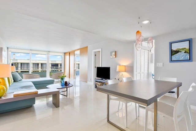 interior space featuring a wall of windows and light tile patterned floors