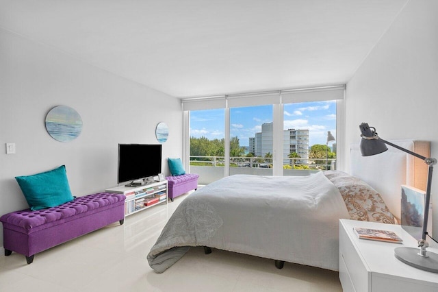 bedroom with floor to ceiling windows