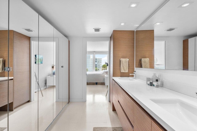 bathroom with tile patterned flooring and vanity