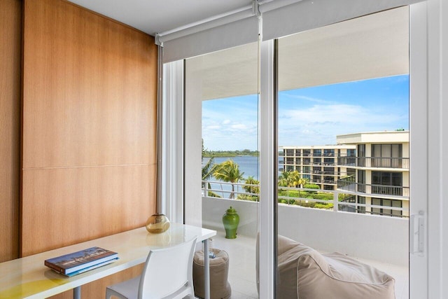 doorway to outside featuring a water view