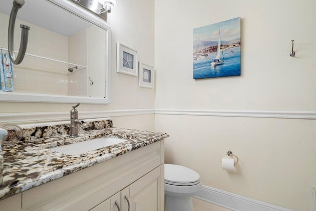 bathroom featuring tile patterned floors, curtained shower, vanity, and toilet