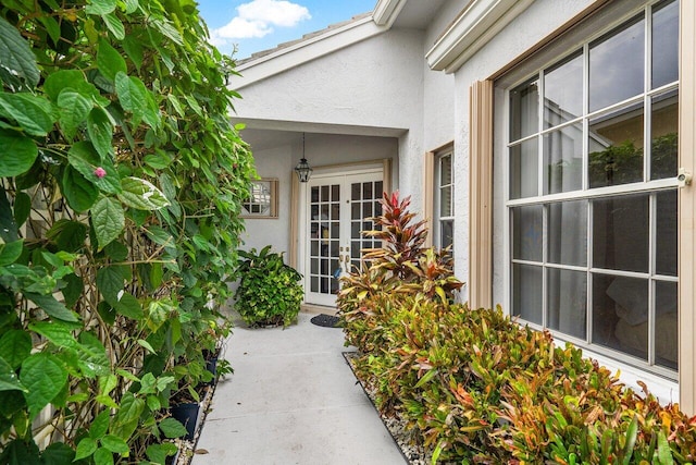 view of exterior entry featuring french doors