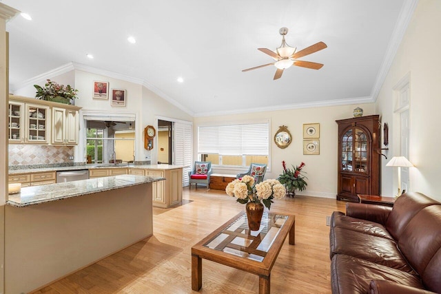 living room featuring ceiling fan, plenty of natural light, light hardwood / wood-style floors, and crown molding