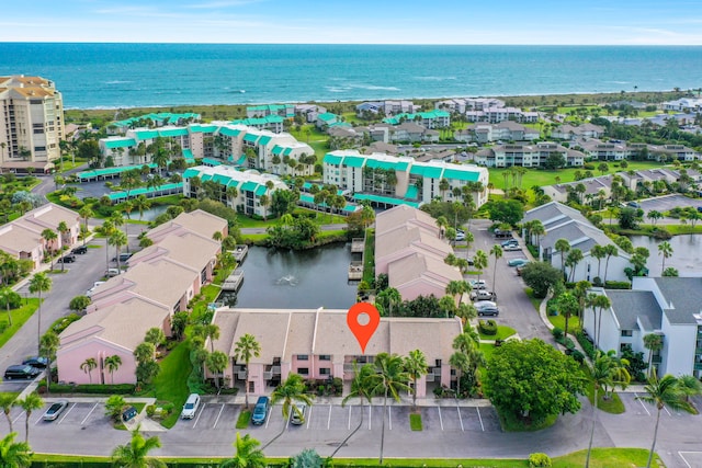 bird's eye view featuring a residential view and a water view