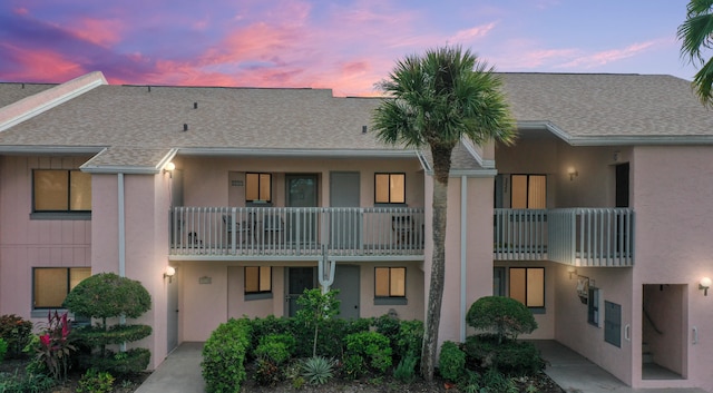 view of outdoor building at dusk