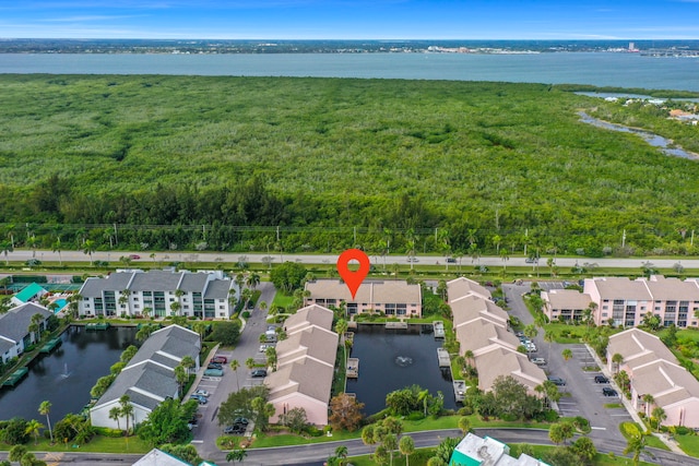 birds eye view of property featuring a water view