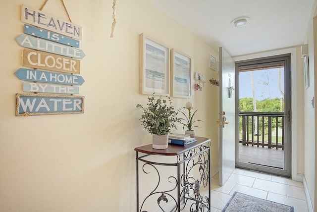 doorway featuring light tile patterned flooring