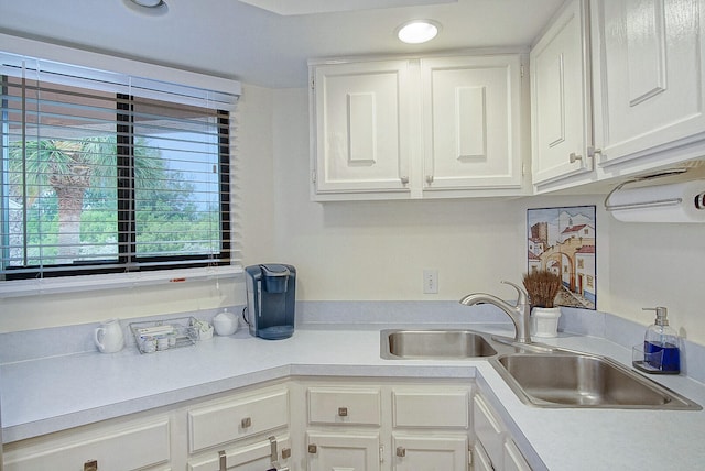 kitchen with sink and white cabinetry