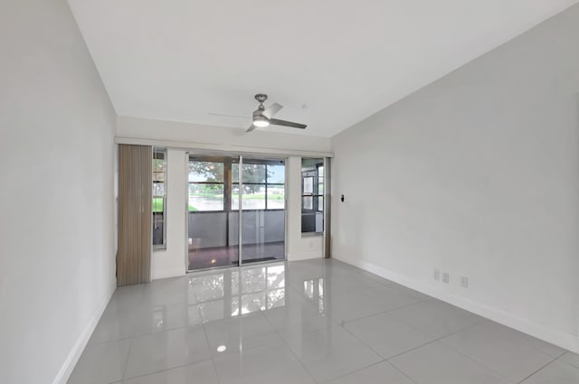 spare room featuring ceiling fan and light tile patterned flooring