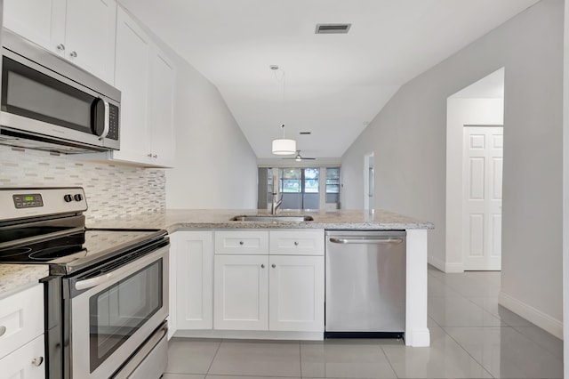 kitchen with kitchen peninsula, sink, stainless steel appliances, and white cabinets