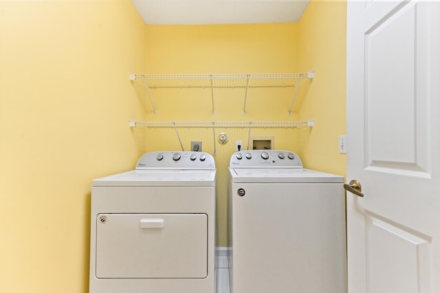 laundry room with independent washer and dryer