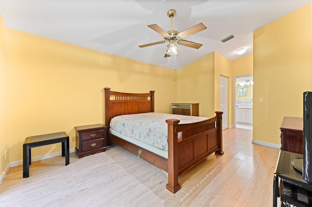 bedroom with connected bathroom, ceiling fan, and light wood-type flooring