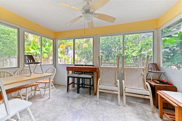 sunroom featuring plenty of natural light and ceiling fan