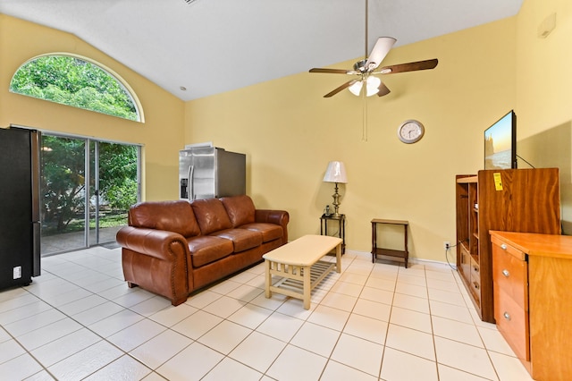 tiled living room featuring ceiling fan and high vaulted ceiling