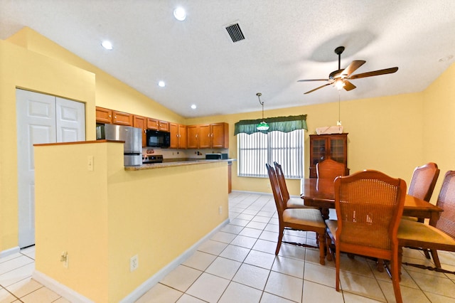 kitchen featuring light tile patterned flooring, pendant lighting, ceiling fan, and black appliances