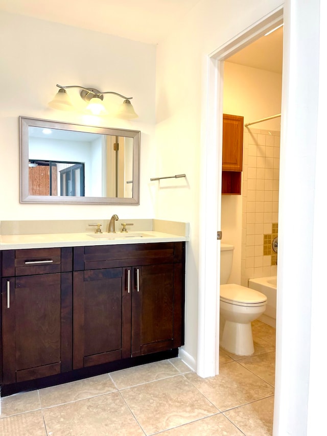 full bathroom with vanity, toilet, and tile patterned floors