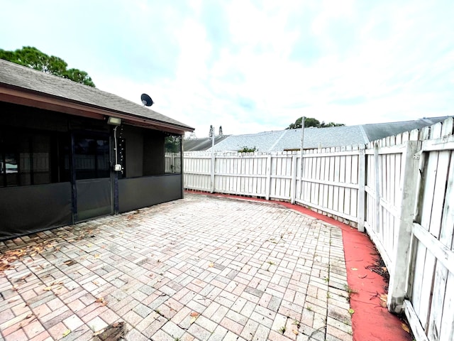 view of patio / terrace with a sunroom