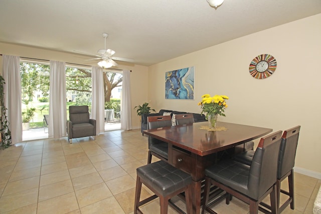 dining room featuring ceiling fan and light tile patterned flooring