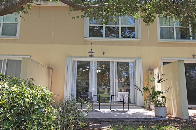 entrance to property with a patio area