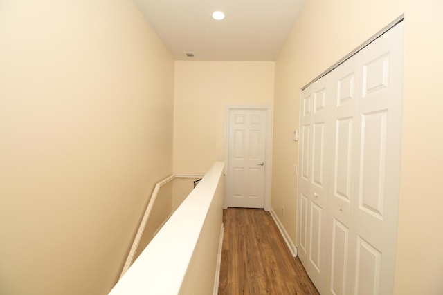 corridor with dark wood-type flooring