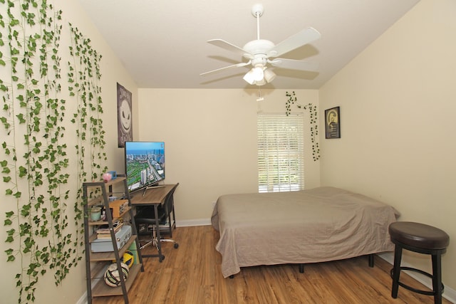 bedroom featuring hardwood / wood-style flooring and ceiling fan