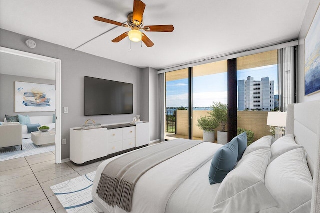 5600 N Flagler Dr Unit 505, West Palm Beach, FL 33407 - bedroom featuring a ceiling fan, multiple windows, and access to outside