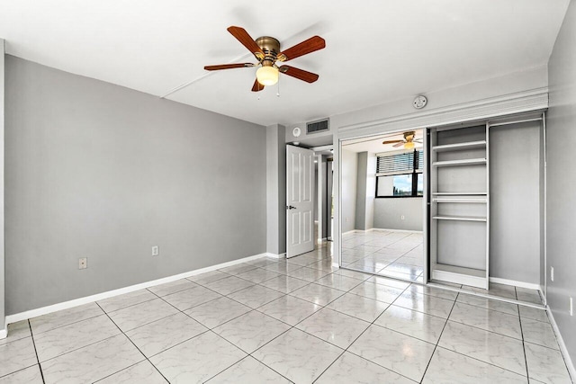 unfurnished bedroom with a closet and ceiling fan