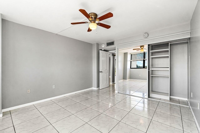 5600 N Flagler Dr Unit 505, West Palm Beach, FL 33407 - unfurnished bedroom with a closet, visible vents, ceiling fan, and baseboards
