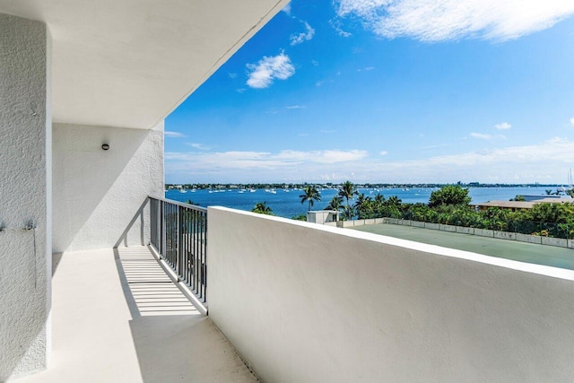 balcony featuring a water view