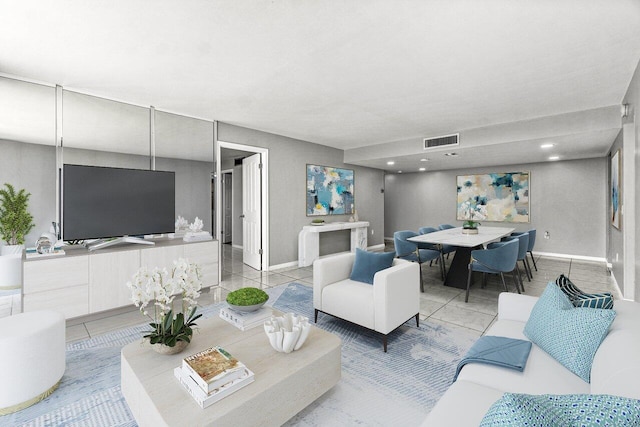 5600 N Flagler Dr Unit 505, West Palm Beach, FL 33407 - living area with light tile patterned flooring, visible vents, and baseboards