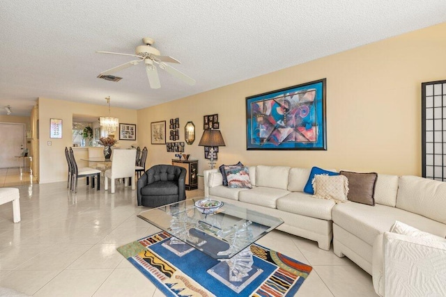 living room featuring light tile patterned floors and a textured ceiling