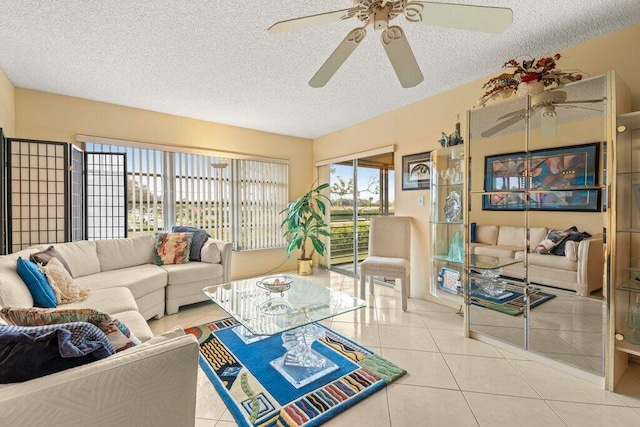 living room with light tile patterned floors and a textured ceiling