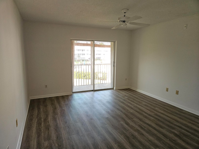 spare room featuring a textured ceiling, dark hardwood / wood-style flooring, and ceiling fan