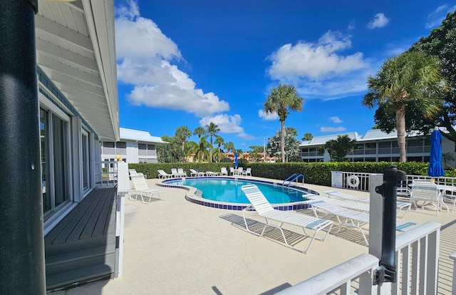 view of swimming pool featuring a patio