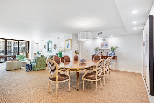 view of carpeted dining space