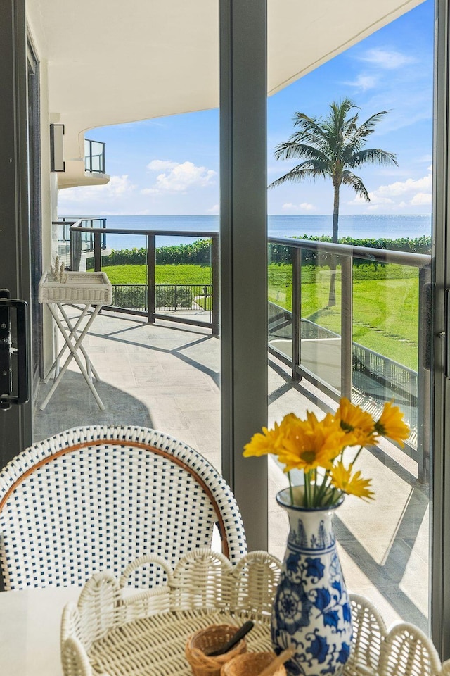 balcony featuring a water view