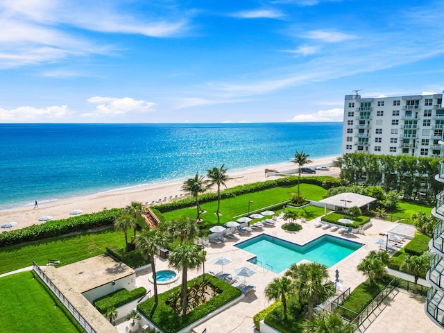 aerial view with a view of the beach and a water view