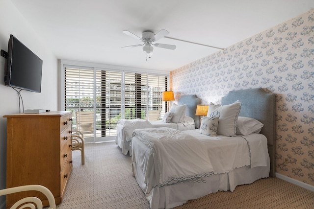 3440 S Ocean Blvd Unit 201N, Palm Beach, FL 33480 - bedroom with wallpapered walls, baseboards, light colored carpet, ceiling fan, and a wall of windows