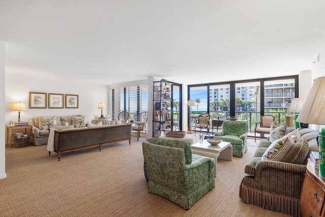 living room featuring light carpet and floor to ceiling windows