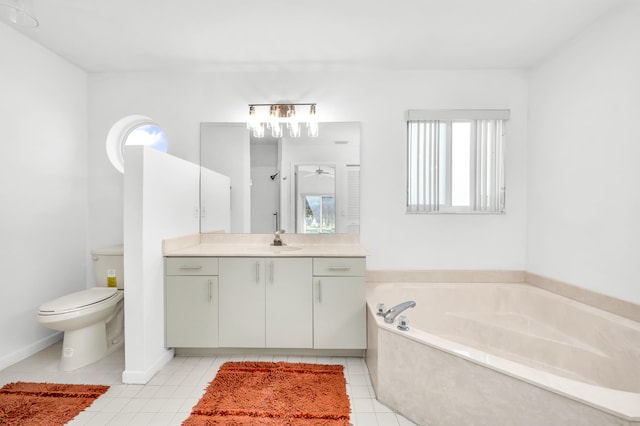 bathroom featuring a washtub, tile patterned floors, vanity, and toilet