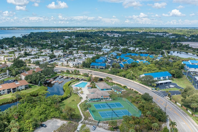 birds eye view of property with a water view