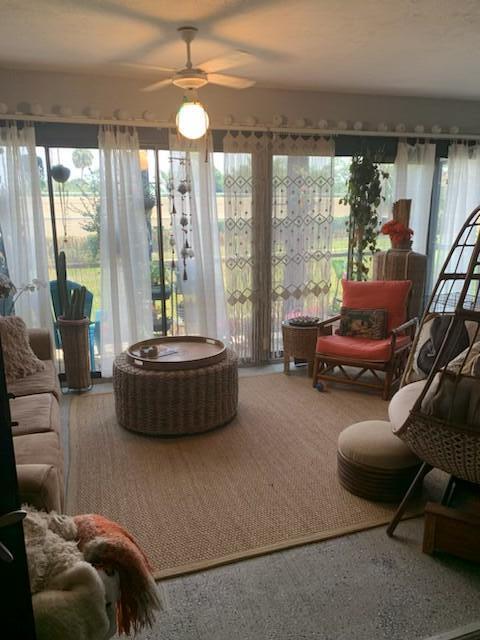 sunroom / solarium with ceiling fan