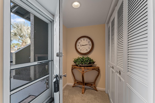 entryway featuring light carpet