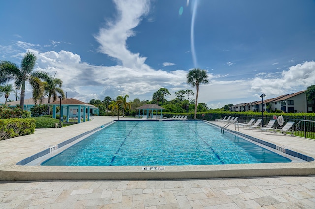 view of swimming pool with a patio